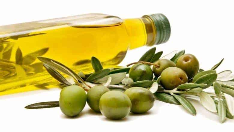 bottle of olive oil with olives