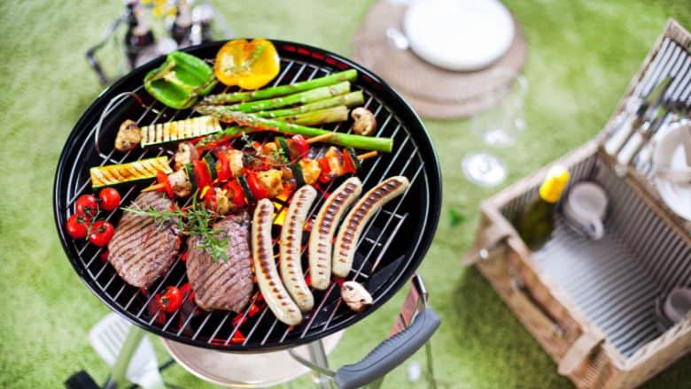 grill grates full of meat and vegetables