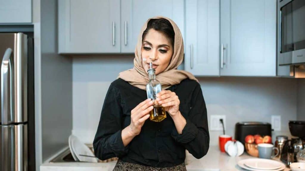 woman tasting olive oil